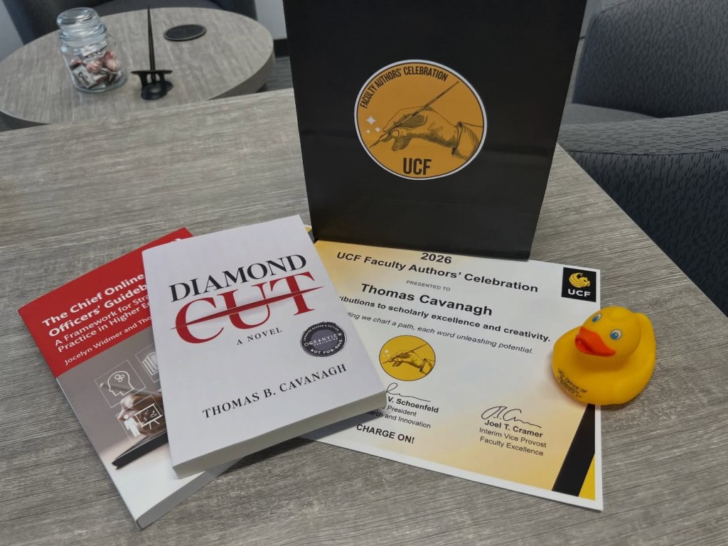 Award certificate, books, and rubber duck