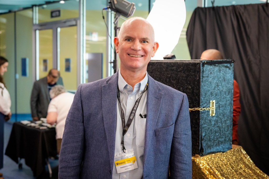 Tom smiling at camera